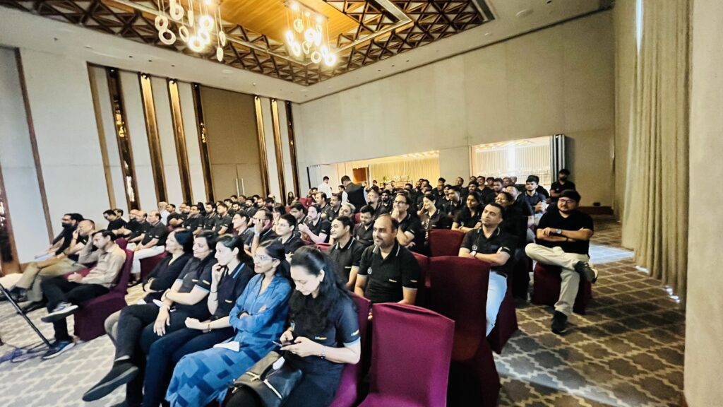 Professionals engaged in focused work and discussion representing a committed and responsible workplace culture.